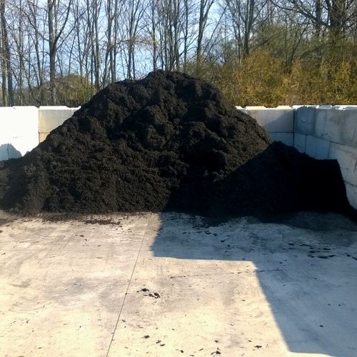 Black hardwood mulch pile in JB's bay